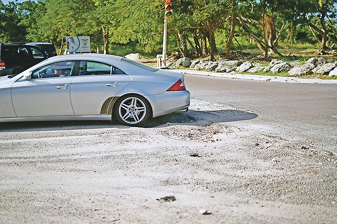 The potholes at the traffic light of Village Road and Shirley Street at the weekend. Photo: Terrel W Carey Sr/Tribune Staff