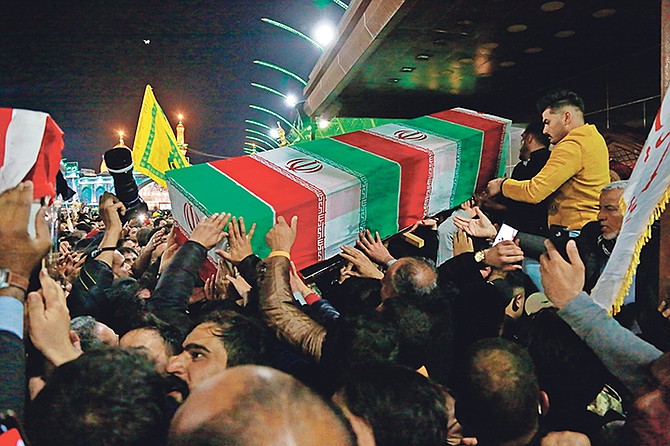 Mourners carry the coffin of Iran's top general Qassem Soleimani during his funeral in Karbala, Iraq, Saturday. (AP Photo/Khalid Mohammed)