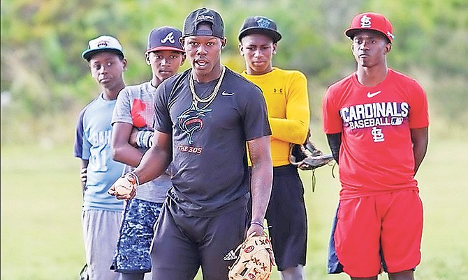 MIAMI Marlins prospect Jazz Chisholm gives some pointers to young, aspiring baseball players during a clinic in conjunction with International Elite-Sports Academy at the Pinewood Gardens baseball field.
Photo: 10th Year Seniors