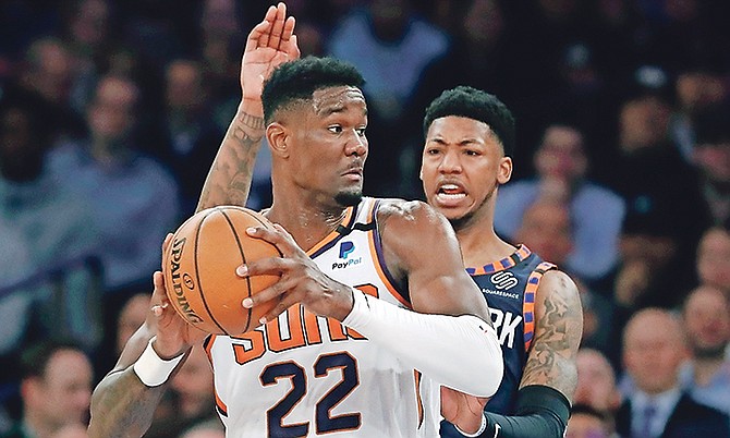 New York Knicks guard Elfrid Payton, right, defends as Phoenix Suns centre Deandre Ayton (22) looks to pass during the first quarter in New York. Ayton and the Suns routed the Knicks 121-98. He scored 26 points, grabbed a career high 21 rebounds and dished out two assists. He also had two blocks.
(AP Photo/Kathy Willens)