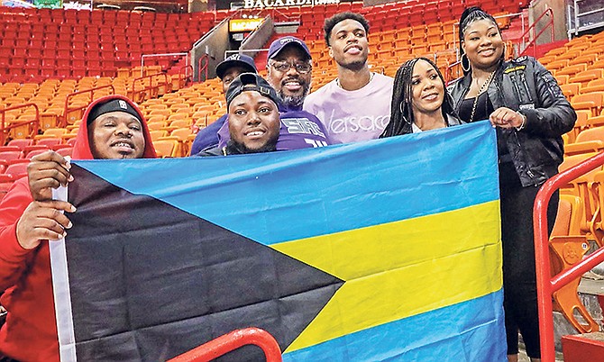 Buddy Hield shares a special moment with a few of his fans at the American Airlines Arena.