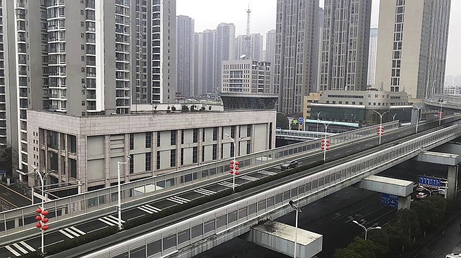 In this photo provided by Chen Yanxi, a nearly-deserted expressway is seen in Wuhan in central China's Hubei Province, Friday. (Chen Yanxi via AP)