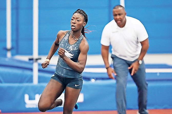 Megan Moss in action as coach Rolando 'Lonnie' Greene cheers her on.