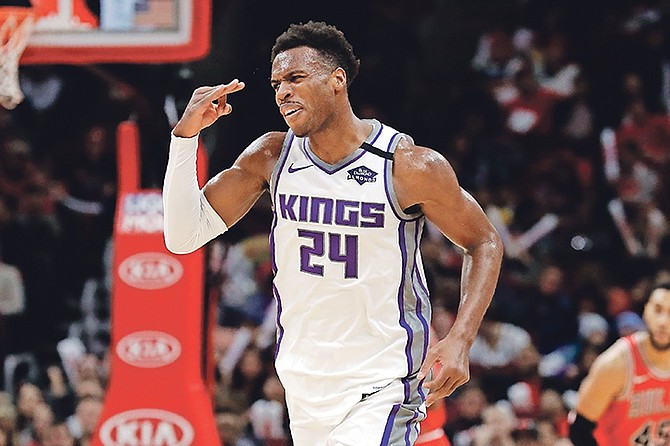 Sacramento Kings guard Buddy Hield reacts after making a three-point basket during the second half against the Bulls.