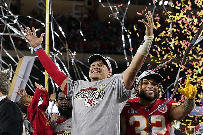 Kansas City Chiefs' Patrick Mahomes, left, and Tyrann Mathieu celebrate after defeating the San Francisco 49ers in the NFL Super Bowl 54 football game in Miami Gardens, Fla. (AP Photo/David J. Phillip)