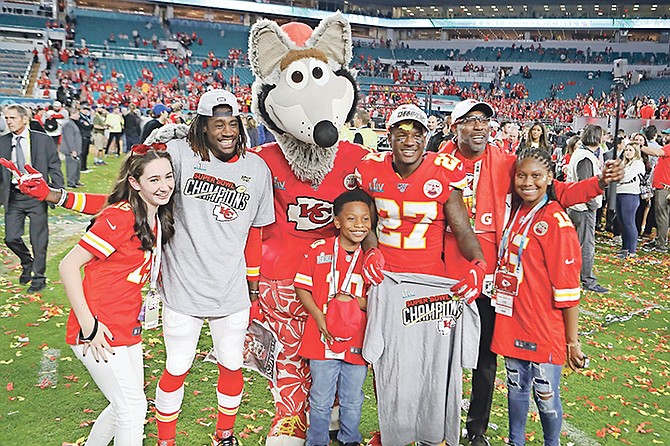 Kansas City Chiefs defensive back Rashad Fenton (27) celebrates with friends and family after the win against the San Francisco 49ers at Super Bowl 54. (AP Photo/Gregory Payan)