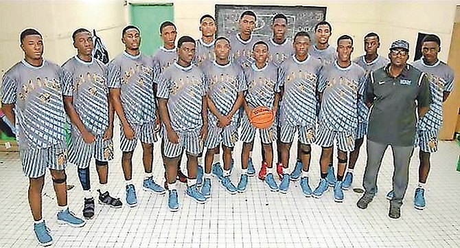 Coach Kevin 'KJ' Johnson, second from right, is pictured with members of his CI Gibson Rattlers senior boys' basketball team.