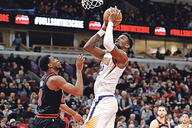 Phoenix Suns centre Deandre Ayton shoots against Chicago Bulls forward Thaddeus Young during the second half on Saturday.

(AP Photo/Nam Y. Huh)