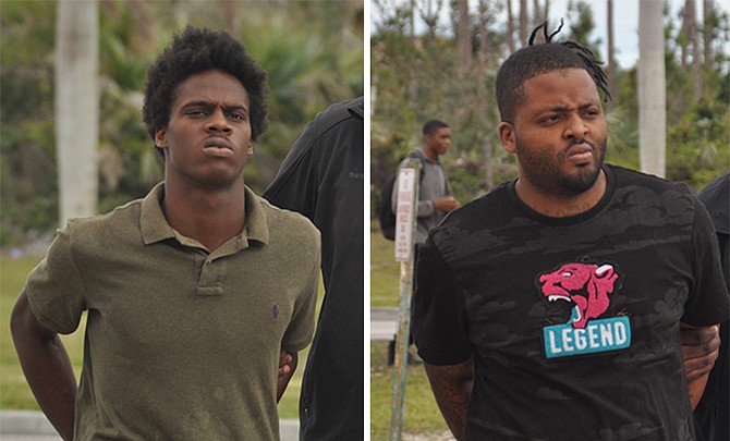 Tyreke Mallory, 21, (left) and Ricardo Jones, 27, are escorted to court on Friday to face murder and abetment to commit murder charges. Photos: Vandyke Hepburn