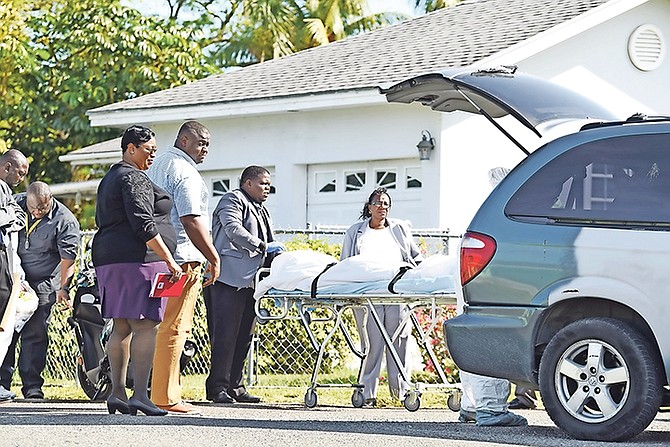 The body is taken from the scene after a police-involved shooting at Sea Breeze Drive. Photo: Shawn Hanna/Tribune Staff