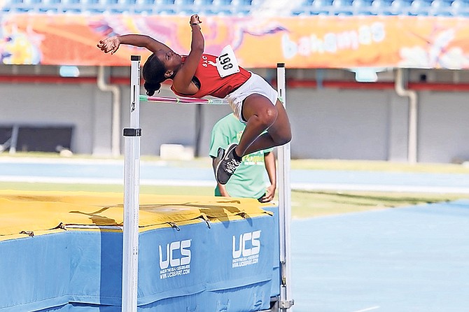 RAISING THE BAR: A St Augustine’s College Big Red Machine student in action on day 1 of the Bahamas Association of Independent Secondary Schools’ Track and Field Championships.