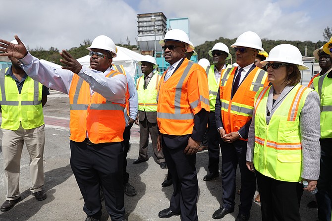 Prime Minister Dr Hubert Minnis being shown around the newly installed engine at Blue Hills Power Station yesterday. The engine will produce at least 30MW of energy.