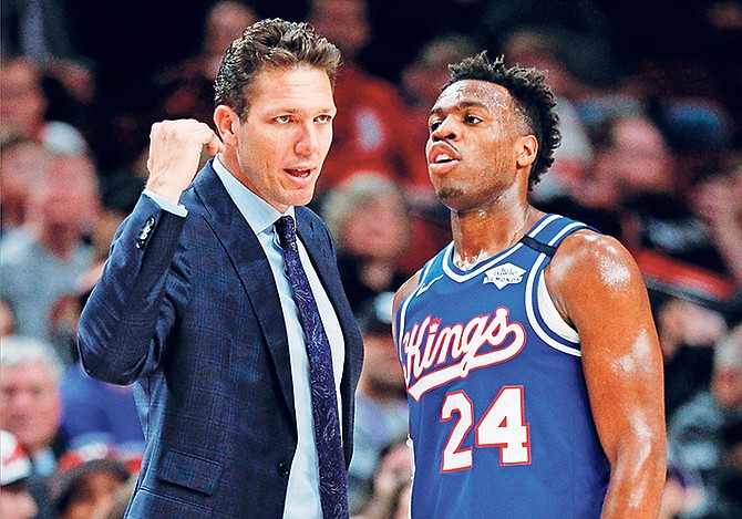 Sacramento Kings coach Luke Walton talks with guard Buddy Hield during the second half against the Portland Trail Blazers on Saturday, March 7. Sacramento won 123-111. Hield sat the entire fourth quarter of the Kings’ 118-113 loss to the Toronto Raptors on Sunday night, prompting criticism of Kings head coach Luke Walton on his management of the rotation.
(AP Photo/Steve Dipaola)