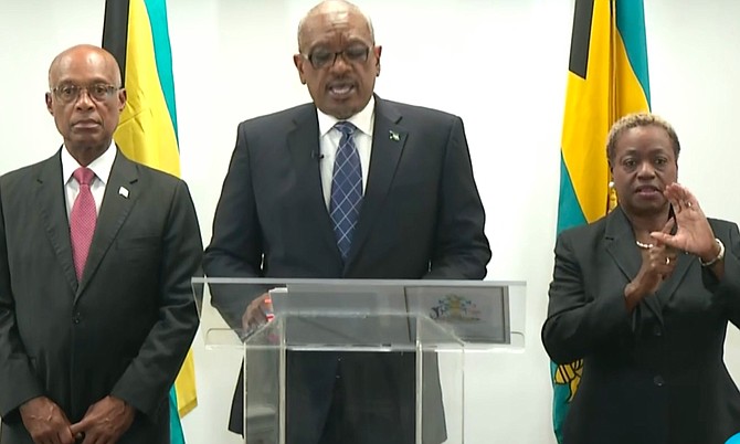 Prime Minister Dr Hubert Minnis delivers his address on Sunday night.