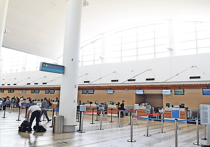 The US departures area at Lynden Pindling International Airport looked pretty deserted yesterday.                                                                                              Photo: Shawn Hanna/Tribune Staff