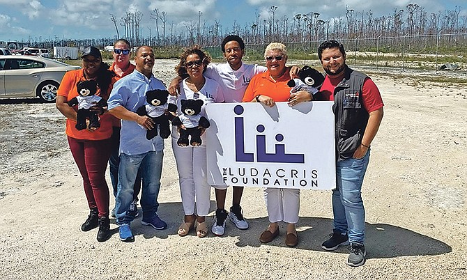 Rapper Ludacris with members of the Ludacris Foundation and HeadORG.