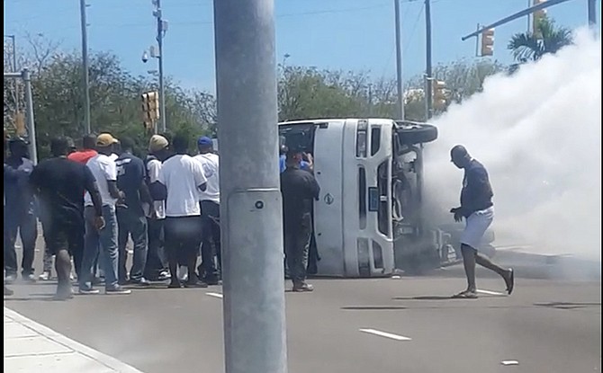 The police bus on its side at Marathon Road.
