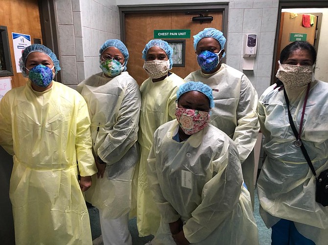 Health care workers at Princess Margaret Hospital with donated masks covering their N95 masks.