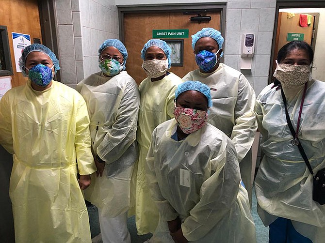 Health care providers at PMH wear their donated masks.