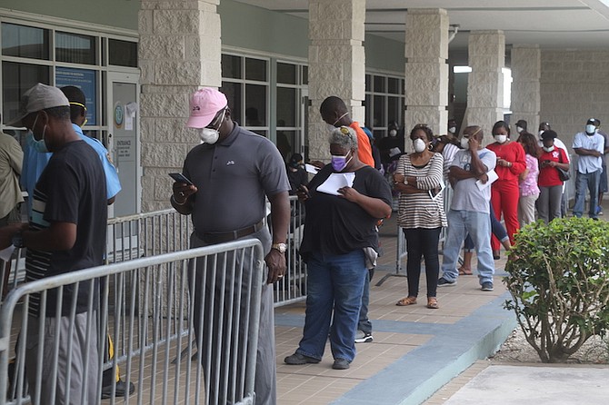 A line with social distancing measures at the Road Traffic Department in Grand Bahama. Road Traffic reopened on Monday in Freeport, processing over 200 applicants daily. The office is open from 9am to 12noon.