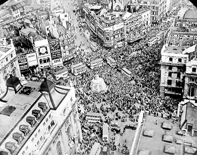 Crowds gather to celebrate VE Day in Piccadilly Circus in London on May 8, 1945.