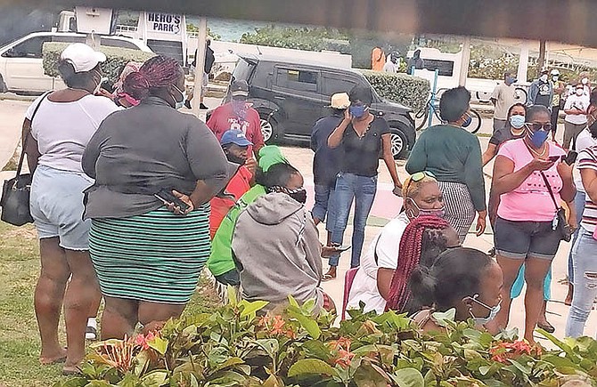 Residents at the Bimini administrator’s office for food vouchers after the Prime Minister’s lockdown announcement.