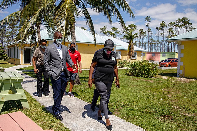 Sheila Johnson-Smith, executive director of Grand Bahama Children’s Home, gives Family Guardian executives a tour of the vegetable garden at the Grand Bahama Children’s Home Wednesday May 13, 2020 in Freeport, Grand Bahama. (SURGE Media Photo/Tim Aylen)