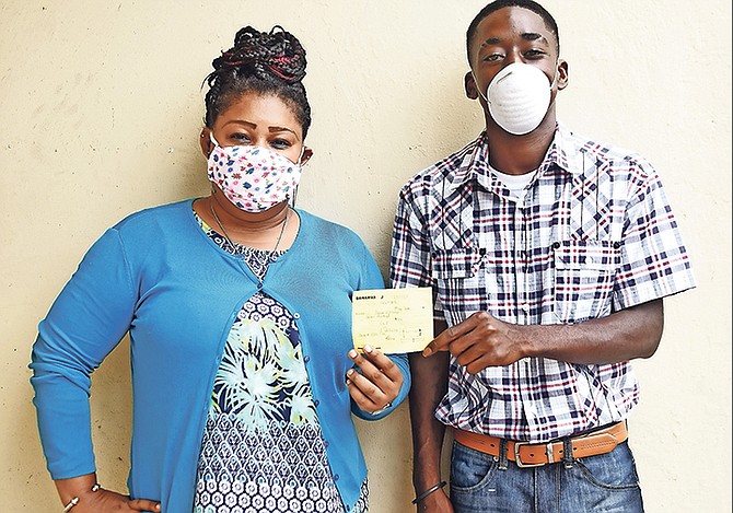 Khandi Gibson along with some of her friends helped raise the funds to pay Jason Williams’ $700 fine for selling coconuts. Photo: Shawn Hanna/Tribune Staff