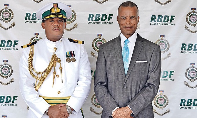 RAYMOND King, left, was officially sworn in as the newest commander of the RBDF yesterday, taking over from Tellis Bethel. Photo: Terrel W Carey Sr/Tribune Staff