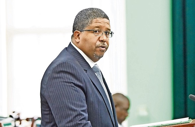 Deputy Prime Minister and Minister of Finance Peter Turnquest delivers the Budget.  Photo: Shawn Hanna/Tribune staff