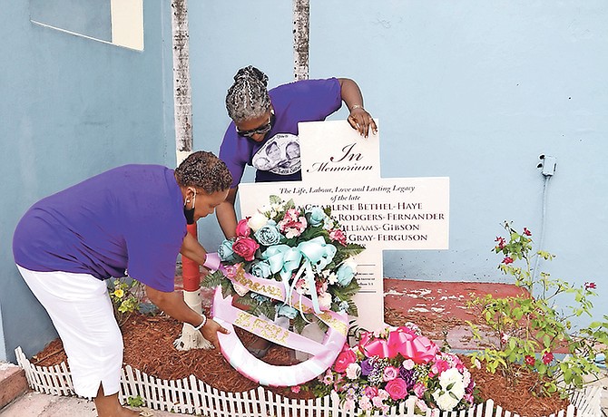 Senator Jennifer Isaacs-Dotson (left) and Theresa Mortimer, president of the Bahamas Financial Services Union, lay a wreath in memory of the four victims of the 2018 Sir Randol Fawkes Labour Day Parade tragedy during a ceremony at Zion Baptist Church. Photos: Patrick Hanna/BIS