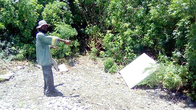 A relative pointing out where Elisia Theoc Loristol’s body was found.