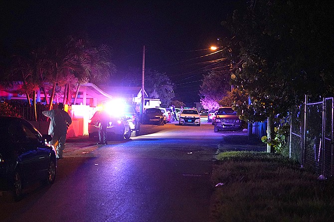 Police at the scene in Nassau Village on Sunday night.