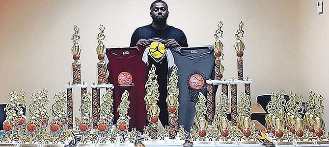 JABARI Wilmott with an array of awards and jerseys for the Hooping by the Park tournament that has been cancelled this year due to COVID-19.