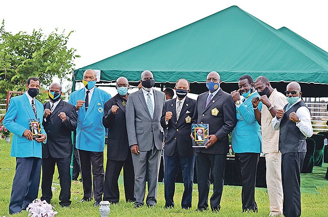 PALLBEARERS pose above during the graveside service for Leonard “Boston Blackie” Miller at Lakeview Cemetery. Photo: Athama Bowe