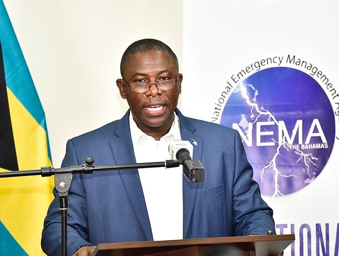 Minister of Health Renward Wells speaks on Friday.