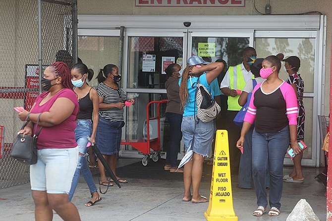 Pre lockdown grocery shopping in Grand Bahama last month.                                                                                                                           Photo: Vandyke Hepburn