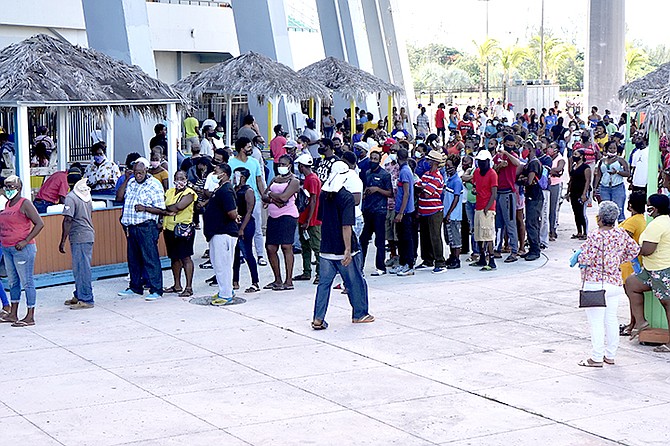 Hundreds flocked to the Thomas A Robinson National Stadium Monday to collect cheques from the NIB after weeks of waiting to receive payouts. Photo: Terrel W Carey Sr/Tribune staff