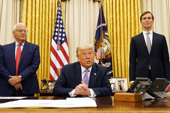 President Donald Trump speaks in the Oval Office at the White House, Thursday, in Washington. Trump said on Thursday that the United Arab Emirates and Israel have agreed to establish full diplomatic ties as part of a deal to halt the annexation of occupied land sought by the Palestinians for their future state. White House senior adviser Jared Kushner is at right. (AP Photo/Andrew Harnik)