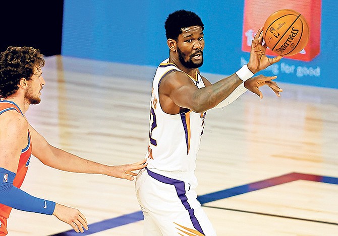 Phoenix Suns’ Deandre Ayton looks to pass against the Oklahoma City Thunder during the second quarter on Monday, August 10, 2020, in Lake Buena Vista, Florida. Today, four teams - Portland, Memphis, Phoenix and San Antonio - will finally decide which two clubs get spots in the play-in series to determine the No. 8 seed in the West playoffs.

(Mike Ehrmann/Pool Photo via AP)