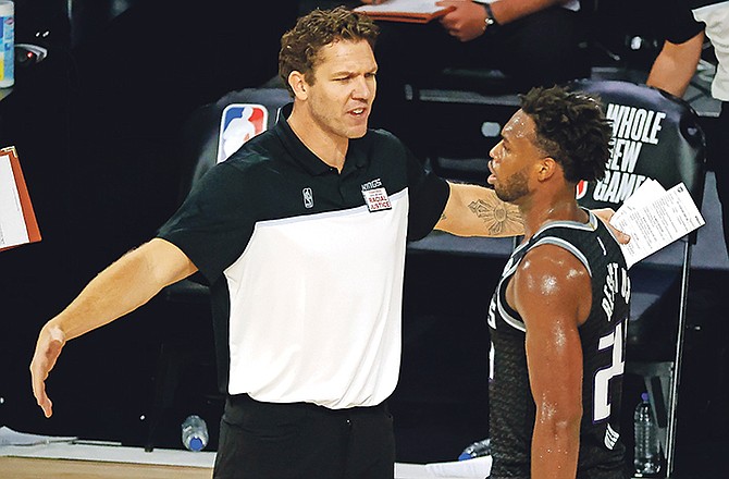 Sacramento Kings head coach Luke Walton, left, talks with Buddy Hield during the fourth quarter against the Los Angeles Lakers on August 13 in Lake Buena Vista, Florida.

(Kevin C Cox/Pool Photo via AP)