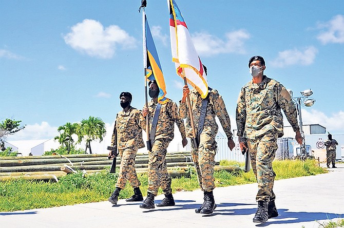 RBDF officers in Abaco paying tribute to victims of Hurricane Dorian. 
Photo: Able Seaman Michael Turner II/RBDF