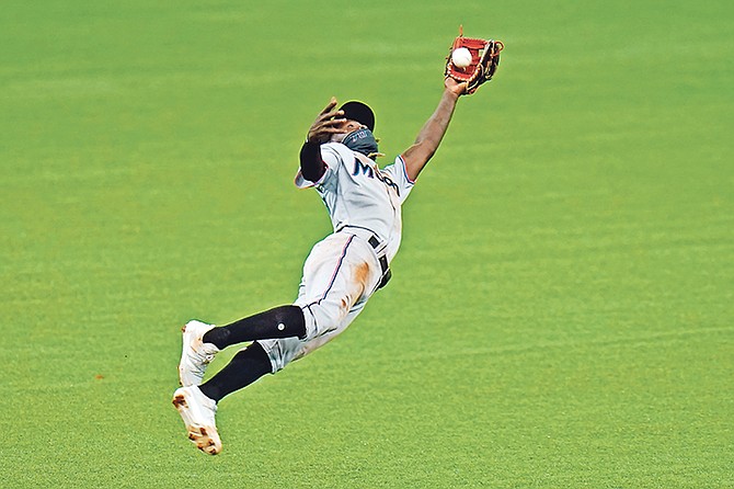 Miami Marlins shortstop Jazz Chisholm (70) makes a diving catch on a pop fly by Tampa Bay Rays’ Nate Lowe during the eighth inning yesterday in St Petersburg, Florida.

(AP Photo/Chris O’Meara)