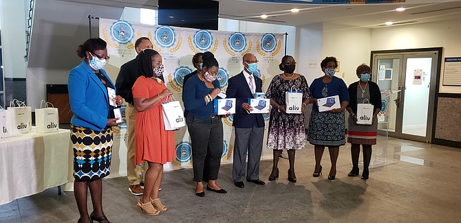 THE MINISTRY of Education receives tablets and wifi boxes from AF Adderley’s Class of 1986.