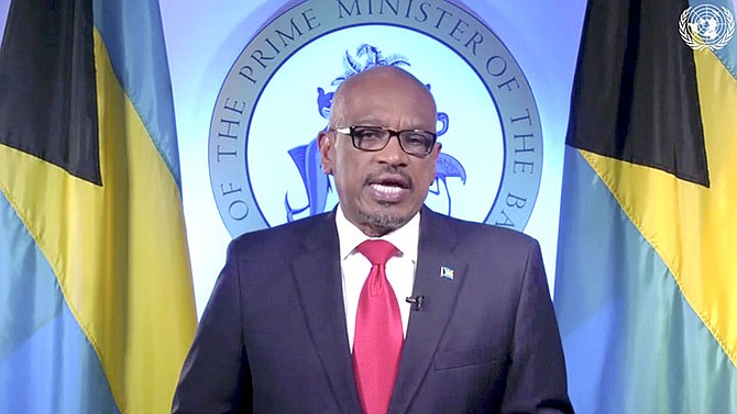 Prime Minister Dr Hubert Minnis speaks in a pre-recorded message which was played during the 75th session of the United Nations General Assembly, Saturday at U.N. headquarters. (UNTV via AP)