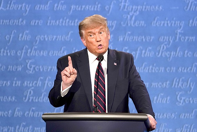 President Donald Trump gestures while speaking during the first presidential debate Tuesday, at Case Western University and Cleveland Clinic, in Cleveland, Ohio. (AP Photo/Julio Cortez)