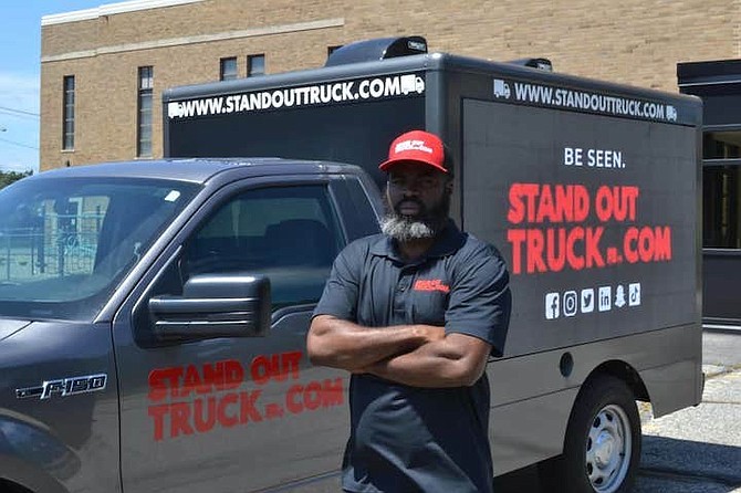 Grand Bahamian Mychal Connolly and his digital truck mobile billboard.
