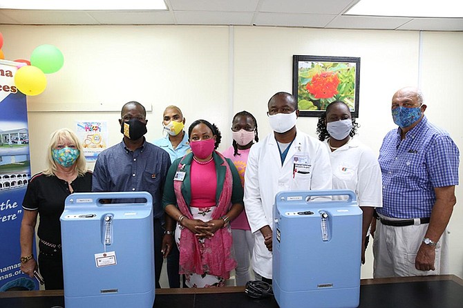 The Rotary Club of Freeport donated nine oxygen concentrators to the Rand Memorial Hospital
on Friday. From left are Rotarians Christina Burrows, president Othyneil Pinder; Elsie Hutcheson; hospital administrator Sharon Williams; Lorine Miller; Dr Freeman Lockhart, medical chief of staff at RMH; Betty van Lew; and Roger Pinder.  Photo BIS.