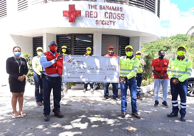 Country Manager, Rogelio Barahona (right), other employees of CEMEX Bahamas and Sean Brennen, director general accompanied by two representatives  of the Bahamas Red Cross Society stand in solidarity in the fight against hunger during COVID-19.