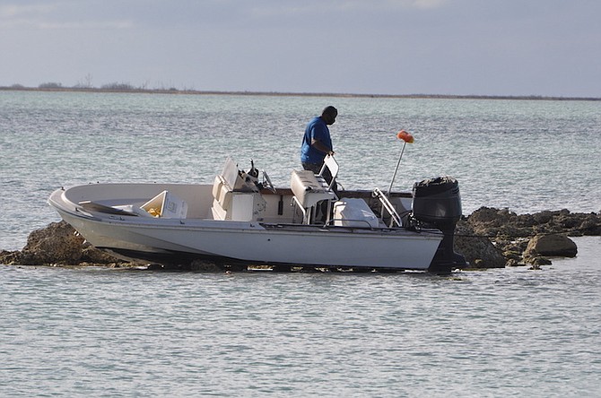 THE AFTERMATH of the boating accident that resulted in three people being taken to hospital. The
incident took place in the Dover Sound area of East Grand Bahama.
Photo: Vandyke Hepburn